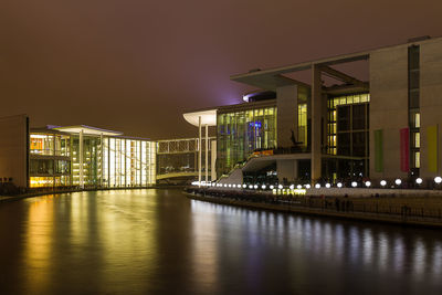 Illuminated buildings in city at night