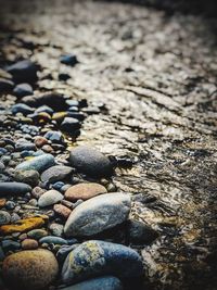 Close-up of pebbles on beach