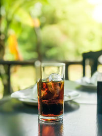 Close-up of beer glass on table