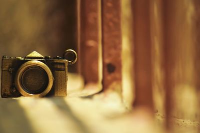 Metal camera on retaining wall