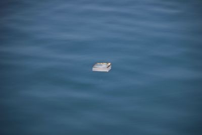 High angle view of boat floating on sea