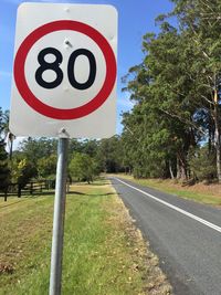 Road sign against sky