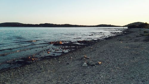 Scenic view of lake against clear sky