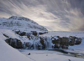 Scenic view of snow covered mountain against sky