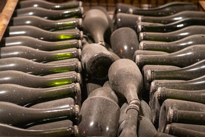 Full frame shot of wine bottles in a cave