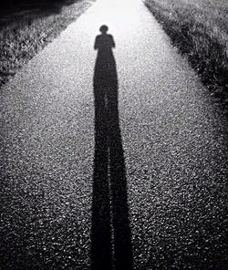 Shadow of people on road