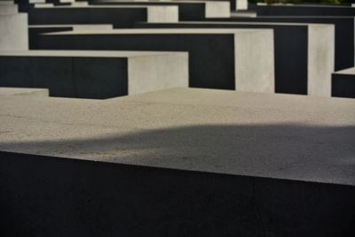 Close-up of concrete road by building