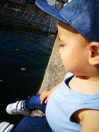 Rear view of boy sitting in boat