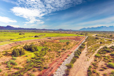 Scenic view of agricultural field against sky