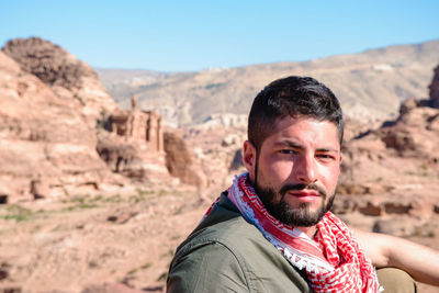 Portrait of mid adult man against mountains