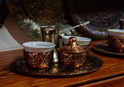 Close-up of tea cups on table