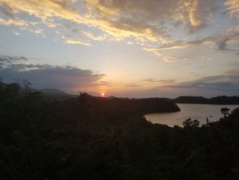 Scenic view of lake against sky during sunset