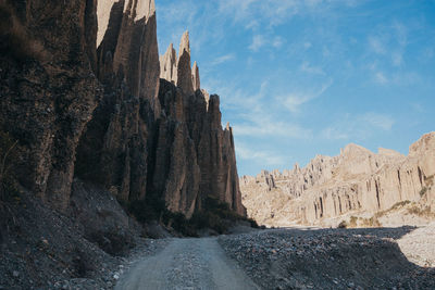 Panoramic view of rocky mountains against sky