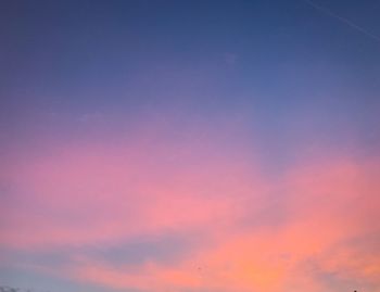 Low angle view of cloudy sky during sunset