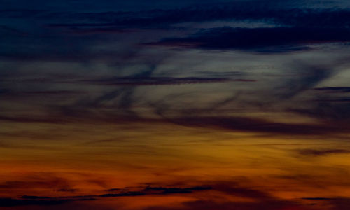 Low angle view of dramatic sky during sunset