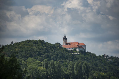 Panoramic view of trees and buildings against sky