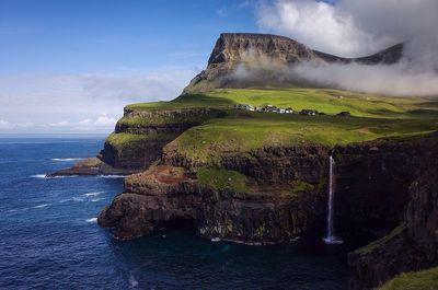 Scenic view of sea against cloudy sky