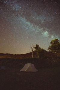 Scenic view of field against sky at night