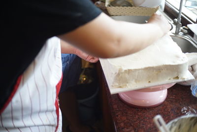 Close-up of person preparing food