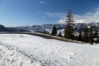 Scenic view of snow field against sky