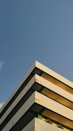 Low angle view of building against clear blue sky