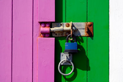 Close-up of padlock on closed door