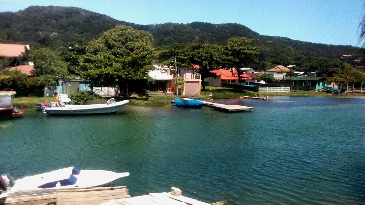 water, mountain, nautical vessel, outdoors, nature, building exterior, moored, no people, tree, day, beach, architecture, sky