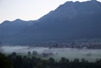 Scenic view of mountains against sky during foggy weather