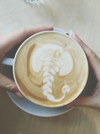 Close-up of woman holding coffee cup