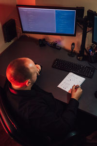 High angle view of man working computers