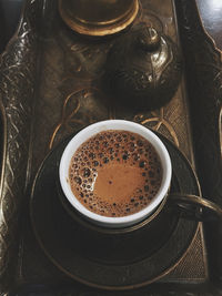 High angle view of coffee cup on table