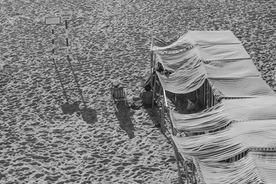 Midsection of person on sand at beach
