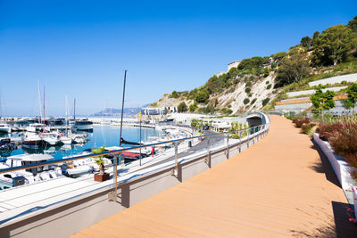 Boats moored at harbor