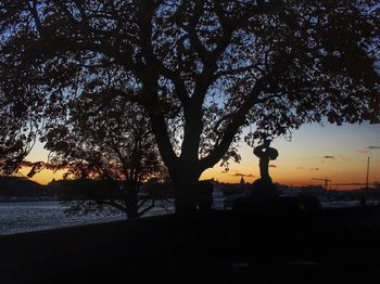 Scenic view of river at sunset