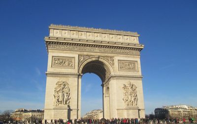 Low angle view of triumphal arch against sky