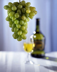 Close-up of grapes on table