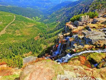 View of river passing through mountains