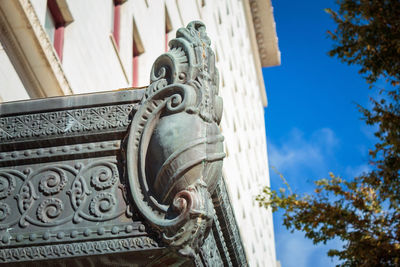 Low angle view of ornate building against sky