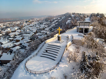 High angle view of snow covered buildings against sky