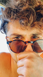 Close-up portrait of man wearing sunglasses