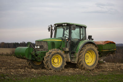 Tractor on field against sky