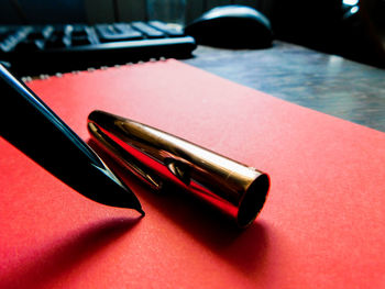 Close-up of pen on table