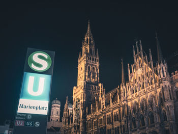 Low angle view of illuminated building against sky at night
