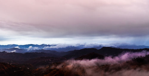Scenic view of mountains against dramatic sky