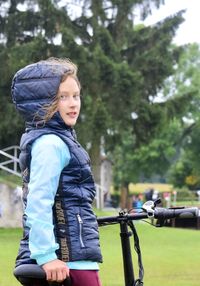 Full length of woman riding bicycle