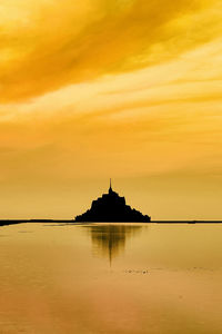 Golden sunrise on mount st michael, normandy