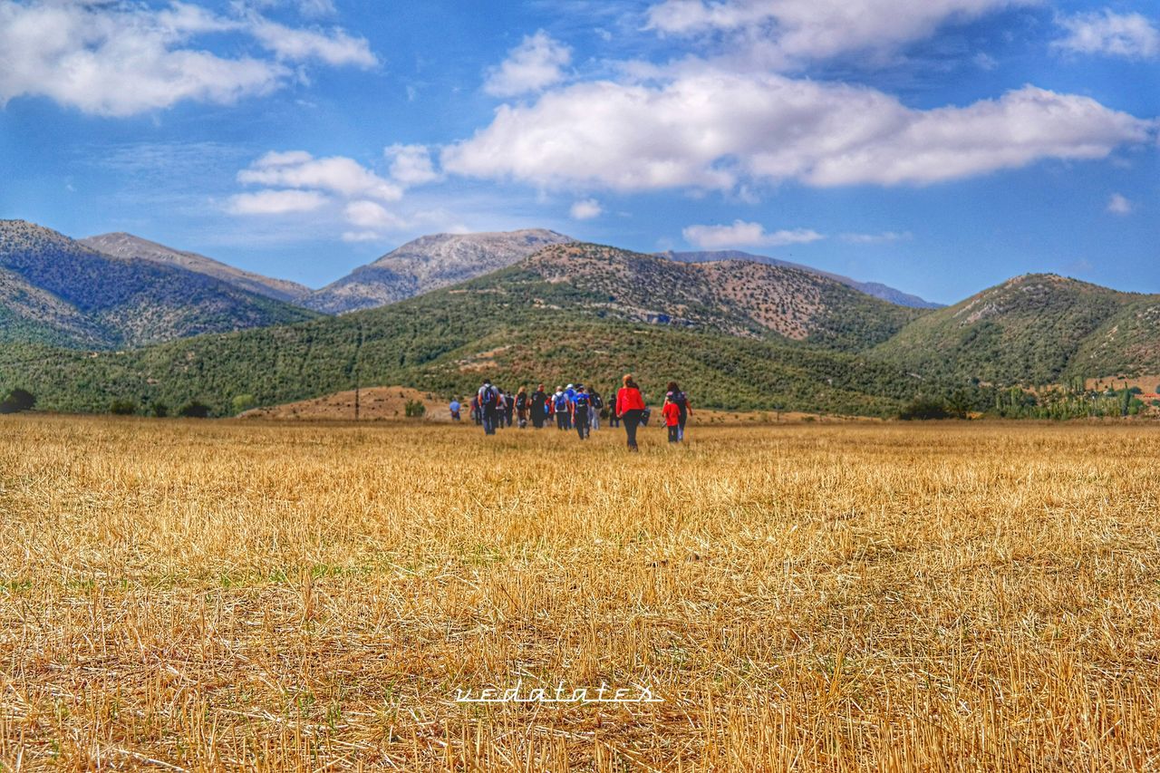 mountain, landscape, sky, tranquil scene, tranquility, mountain range, scenics, beauty in nature, men, nature, leisure activity, cloud - sky, lifestyles, person, field, rural scene, cloud, agriculture, non-urban scene