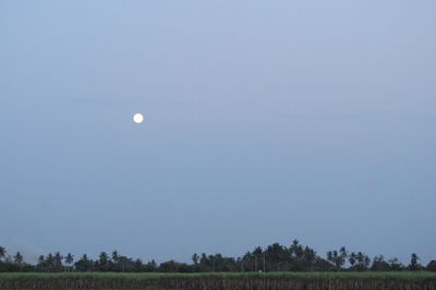 Scenic view of moon against clear sky at night