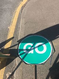 High angle view of road sign on street