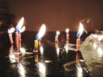 Close-up of burning candles